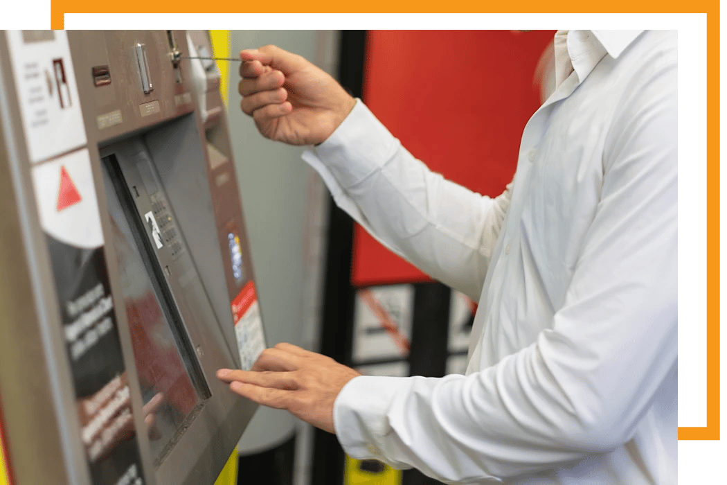 Person inserting a ticket on a vending machine