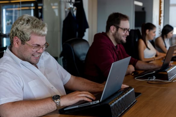 Alter Solutions consultants working together Alter Solutions consultants working together