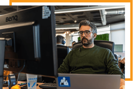 Alter Solutions pentester working at the office