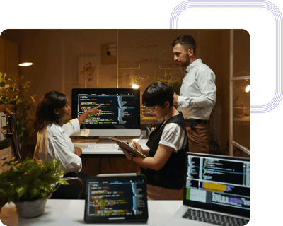 Security analysts working on software patches to correct system vulnerabilities