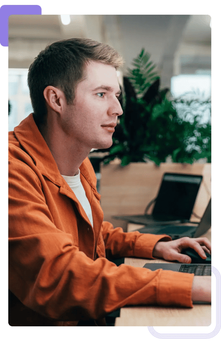 Cybersecurity account manager working on project proposal at the computer