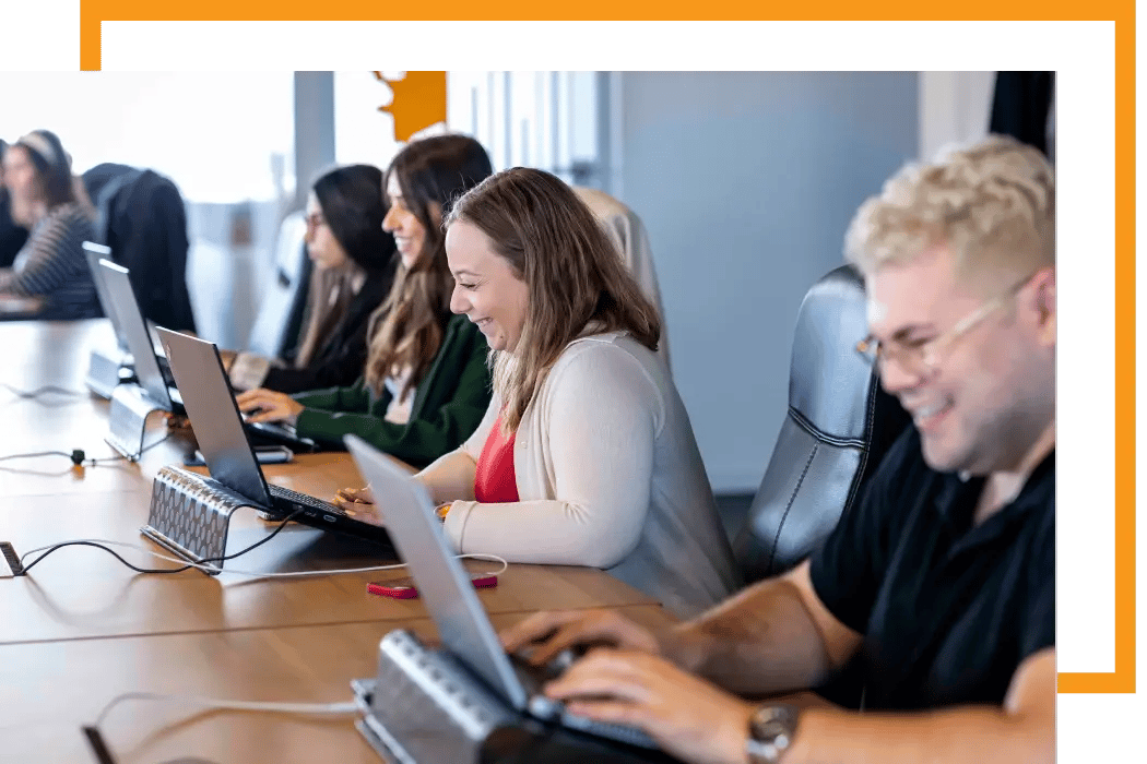 Outsourcing team of software developers on a team meeting
